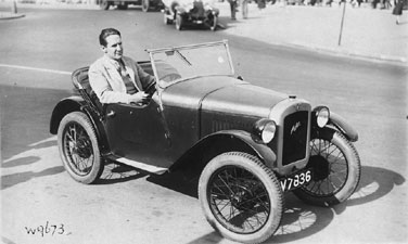 Photo of James Madison Carpenter Sitting in an Austin Roadster